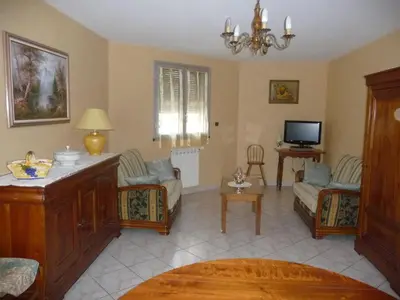a living room with a couch and a tv at Havre de Paix Centre ville Narbonne, T3 confortable, près de l'ARENA et du GRAND BUFFET in Narbonne