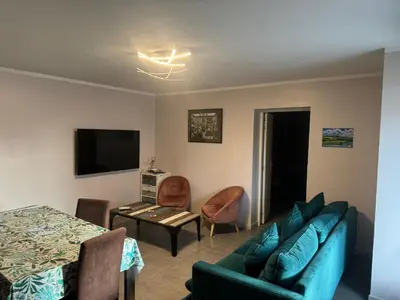 a living room with a couch and a table at Nid douillet in Villemoustaussou