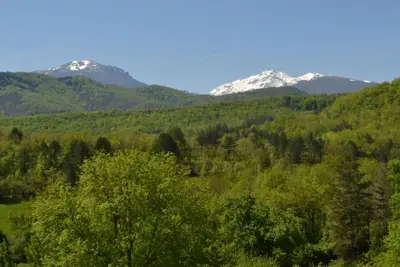a mountain range with snow capped mountains in the background at Gîtes du Hameau Baylesse in Saint-Jean-dʼAigues-Vives