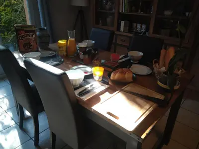 a wooden table with a thanksgiving meal on it at Chambre avec petit déjeuner in Carcassonne