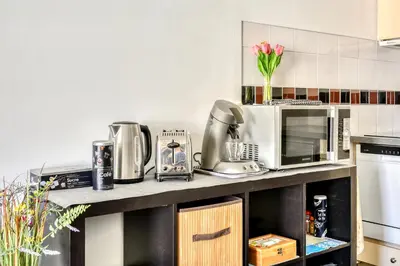 a kitchen with a counter with appliances on it at Grand studio la Presqu'île 2 in Gruissan