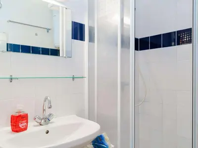 a white bathroom with a sink and a shower at Pavillon 3 pièces avec Terrasse à Gruissan - 4 Couchages, Animaux Admis, Parking Privé - FR-1-409-31 in Gruissan