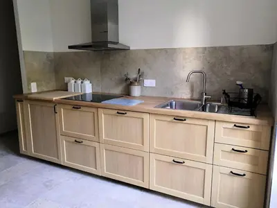 a kitchen with a sink and a counter top at Gîte Wistéria in Mazamet