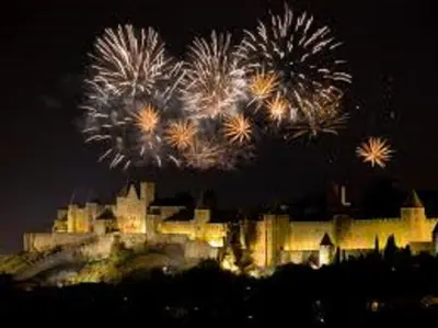 a castle with fireworks in front of it at night at Just Like home in Carcassonne in Carcassonne