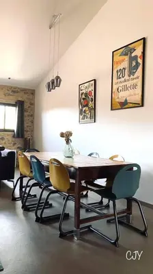 a dining room with a table and chairs at Gîte Chez Les Brocs in Canet d'Aude