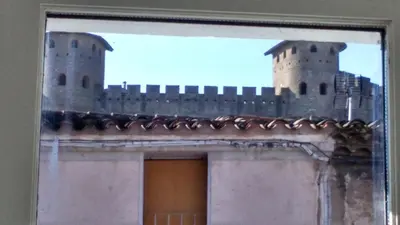 a picture of a castle on top of a building at Gîte les 3 tours 1e étage in Carcassonne