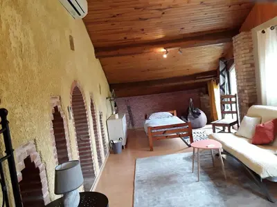 a living room with a couch and a table at LA LOUISIANE 31 in Villefranche-de-Lauragais