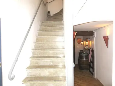 a stairway leading up to the basement of a house at cote de la cite medievale in Carcassonne