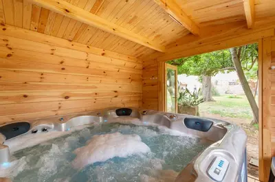 a jacuzzi tub in a wooden house at Domaine de Parazols in Fabrezan