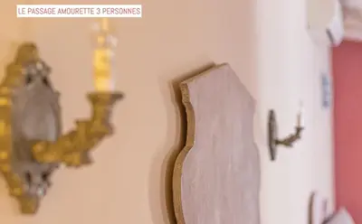 a wall with a clock on a wall at Le Passage in Carcassonne