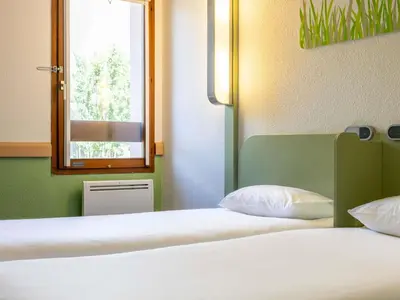 a room with two bunk beds and a ladder at ibis budget Narbonne Sud A9/A61 in Narbonne