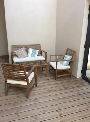 a room with two chairs and a table and chairs at villa du chai studio pyrénées in Lézignan-Corbières