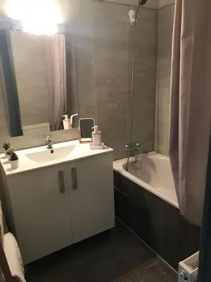 a bathroom with a sink and a bath tub at Marina in Narbonne