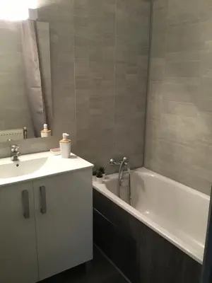 a bathroom with a tub and a sink and a bath tub at Marina in Narbonne