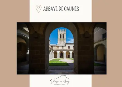 a picture of a building with a clock tower at Apartment Jeanne in Carcassonne