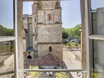 a view of a castle from a window at Apartment Carcasses in Carcassonne