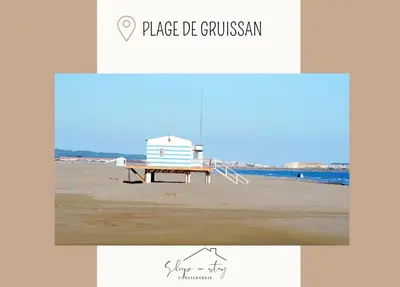 a picture of a beach with a bench and a lighthouse at Apartment Carcasses in Carcassonne
