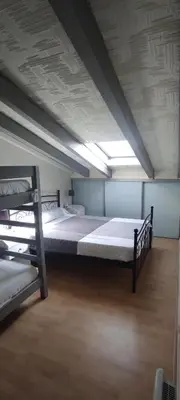 a large room with two bunk beds in it at Gites Vert à la mer climatisation dans toutes les pièces in Port-la-Nouvelle