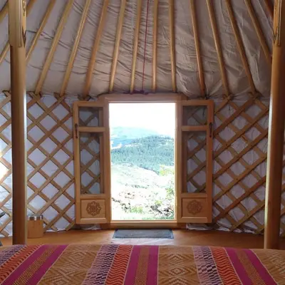 a room with a large window in a yurt at Yourte Mongole Insolite - Gîte Saint Roch in Tuchan