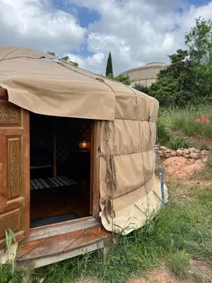 a tent that is sitting in the grass at Yourte Mongole Insolite - Gîte Saint Roch in Tuchan