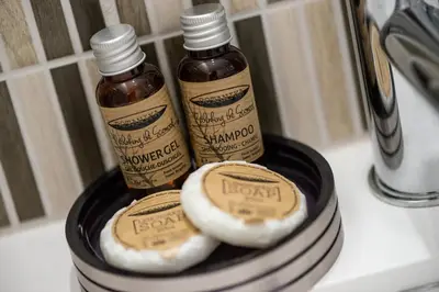 two bottles of hot sauce sitting on a plate at La Maisonnette Narbonnaise (Proche Grands Buffets) in Narbonne