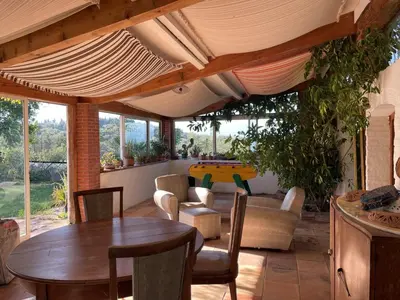 a living room with a table and chairs at Belrepayre in Manses