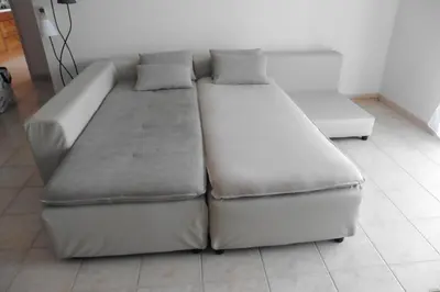 a white couch with two pillows on it at Escapade Audoise in Sallèles-dʼAude