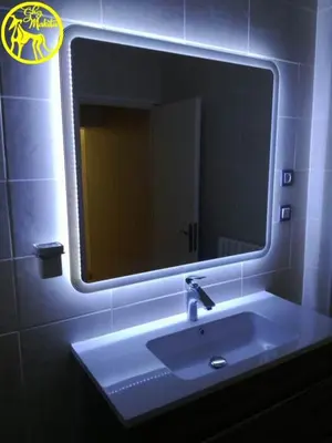 a bathroom with a sink and a mirror at Chez Makita - RdC in Mirepeisset