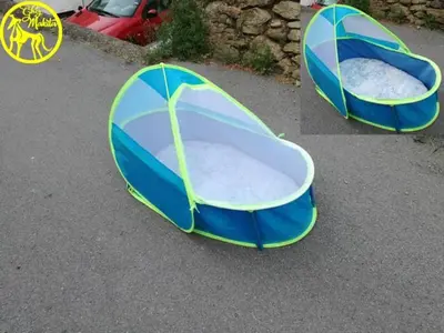 two blue and green beds on the ground at Chez Makita - RdC in Mirepeisset