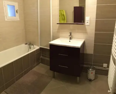 a bathroom with a sink and a bath tub at Côté chateau in Carcassonne