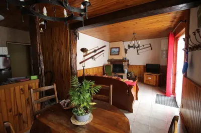 a dining room with a table with a plant on it at Toupinat in Montferrier