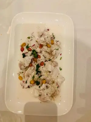 a white plate of food on a table at Casa Cessenon in Cessenon