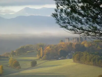 a view of a field with a mountain in the background at Maison Marie in Lagarde