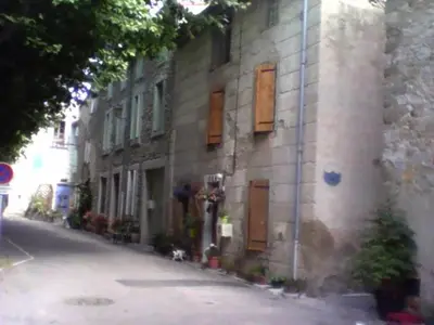 a building on the side of a street at La maison des vendangeurs in Trausse