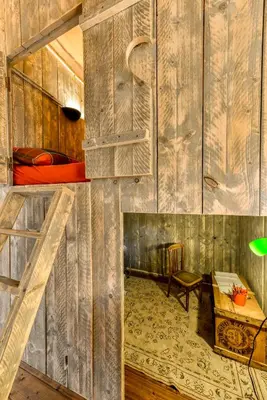 a room with two bunk beds and a desk at Glamping Tent Joy in Vélieux