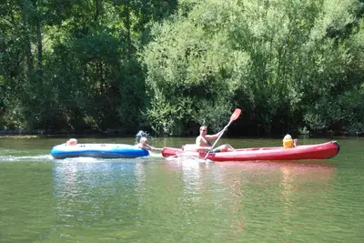a group of people in boats in the water at Glamping Tent Joy in Vélieux