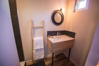 a bathroom with a sink and a mirror at Hôtel Le C - Boutique Hôtel in Narbonne