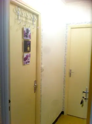 a hallway with two white doors next to each other at Studio confortable, Rennes les bains, 17 m² + Balcon in Rennes-les-Bains