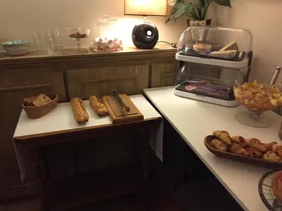 a kitchen with a counter with some food on it at Domaine Le Village in Villenouvelle