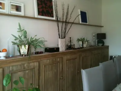 a wooden cabinet with potted plants on top of it at Domaine Le Village in Villenouvelle