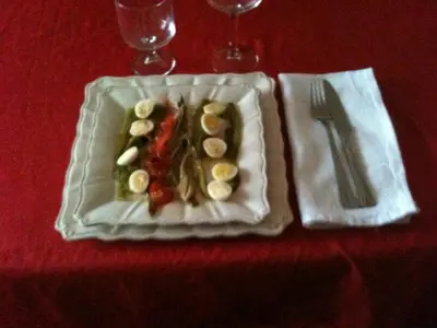 a plate of food on a table with a fork and knife at Domaine Le Village in Villenouvelle