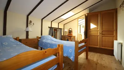 a bedroom with two bunk beds and a closet at Gite complex near Mirepoix in the Pyrenees in Limbrassac
