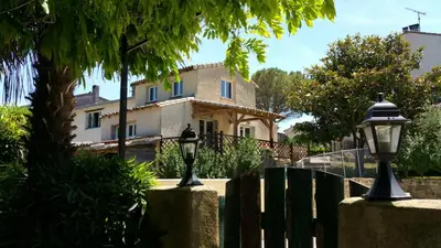 a house with two street lights in front of it at Gite complex near Mirepoix in the Pyrenees in Limbrassac