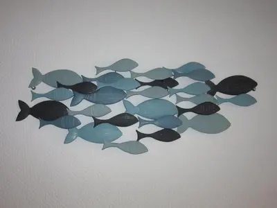 a group of fish swimming in a group at Maison près de la plage in Port-la-Nouvelle