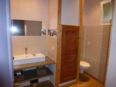 a bathroom with a sink and a toilet at Château La Villatade in Sallèles-Cabardès