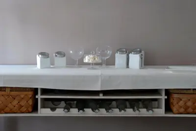 a table with wine glasses and napkins on it at La Maison Vieille Maison d'Hôtes & Gîtes in Carcassonne