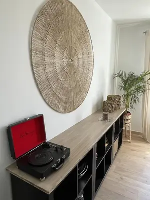 a kitchen with a counter with a stove and a mirror at Le Gîte de la Bade in Villegailhenc