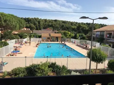 a large swimming pool with many people in it at Villa T2 Mezzanine 4 pers avec Parking à La Franqui - FR-1-81-370 in La Franqui-Plage