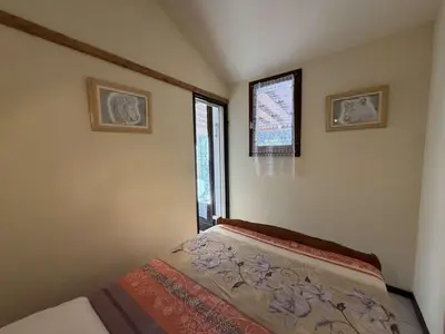 a small bedroom with a bed and a window at Villa T2 Mezzanine 4 pers avec Parking à La Franqui - FR-1-81-370 in La Franqui-Plage