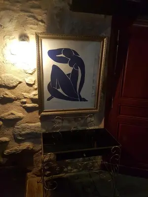 a picture of a woman on a stone wall at Les Treillettes in Puylaurens